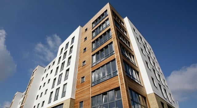 Modern building with many windows and wood exterior exterior at Beaumont Court in London Student Accommodation