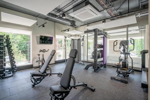 Weight rack benches cardio machines gym area at Hillfort House in Brighton Student Accommodation