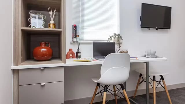 Desk with laptop chair and shelves study area at Berkshire House Reading in Reading Student Accommodation