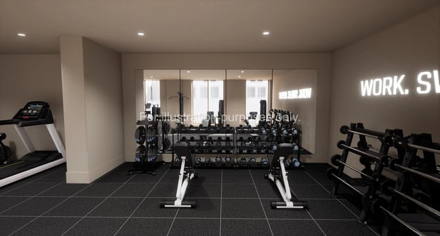 Treadmill weight racks benches and neon sign gym at The Sail Works in Lancaster Student Accommodation