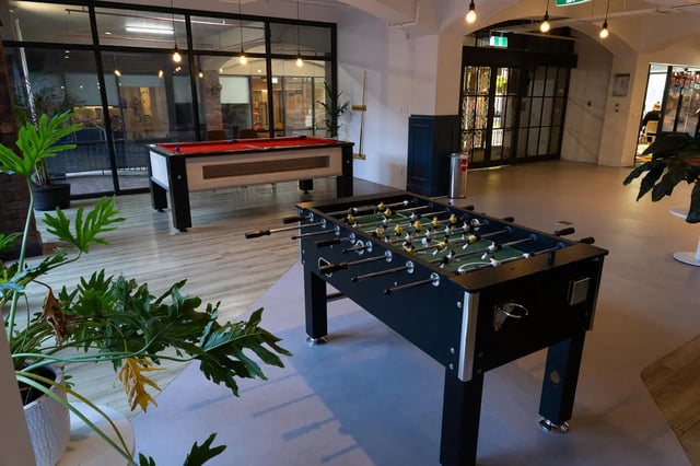 Foosball table billiard table plants play area at dwell Village Melbourne City in Melbourne Student Accommodation