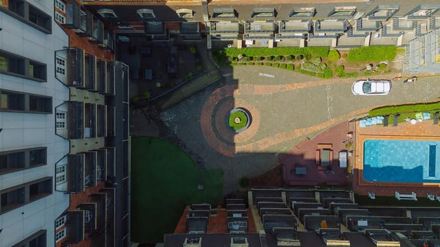 Apartment buildings with pool courtyard exterior at dwell Village Melbourne City in Melbourne Student Accommodation