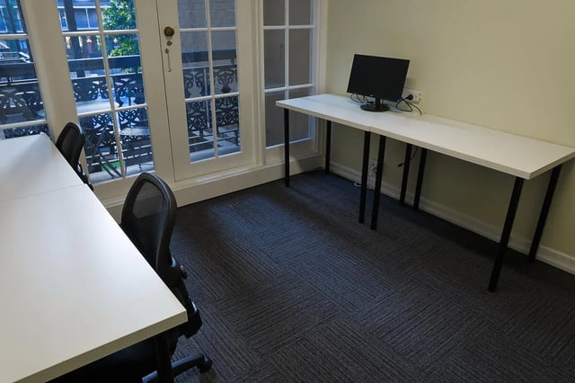 Two desks one with a computer study area at dwell Village Melbourne City in Melbourne Student Accommodation