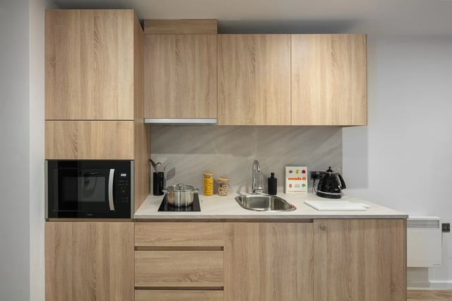 Modern student kitchen with microwave sink kettle Kitchen at The Fabric Works in Leeds Student Accommodation