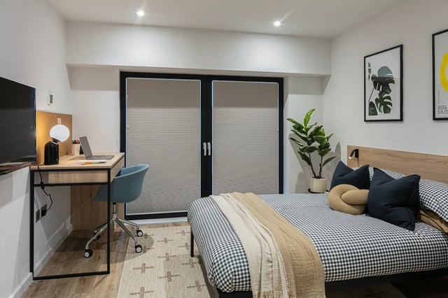 Bed desk plant and artwork bedroom at The Fabric Works in Leeds Student Accommodation