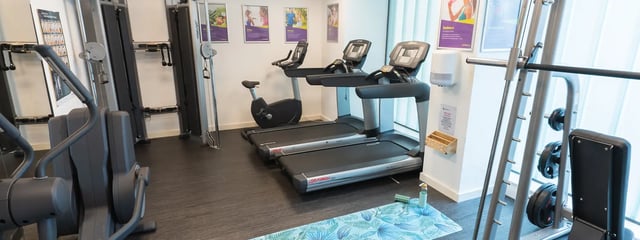 Gym equipment with treadmills exercise bikes and weights playing area at Oxford House - Newcastle in Newcastle Upon Tyne Student Accommodation