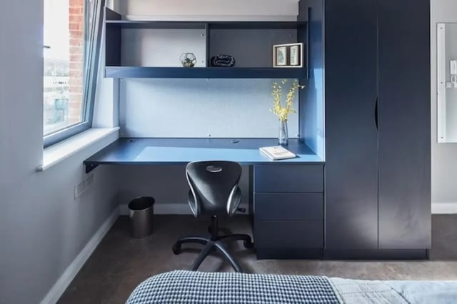 Desk chair wardrobe shelves and bed Study area at Alumno Falmer in Brighton Student Accommodation