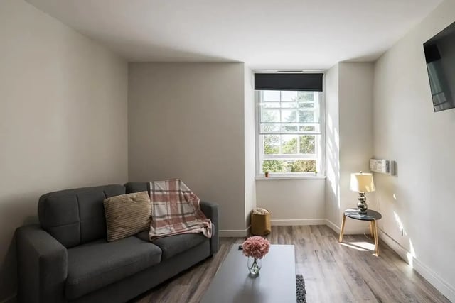 Sofa throw table window lamp basket vase living room at Lyon Street Terrace in Dundee Student Accommodation