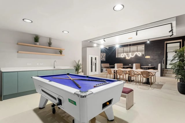 Pool table kitchen area dining area lounge at Cathedral Park in Bristol Student Accommodation