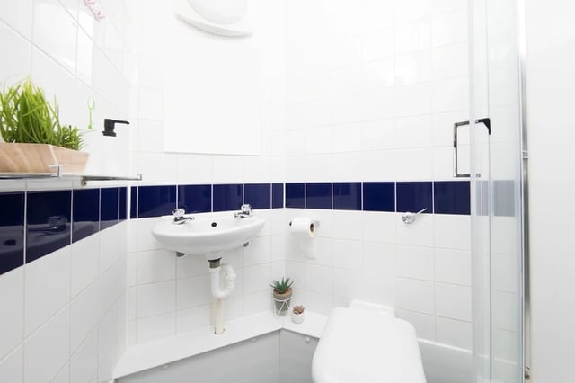 Sink toilet shower plants student bathroom at Sir Charles Groves Hall in Manchester Student Accommodation