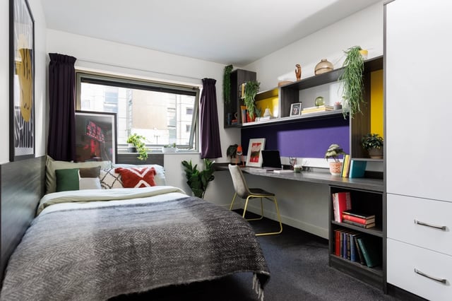 Bed desk chair plants and shelves bedroom at Sir Charles Groves Hall in Manchester Student Accommodation