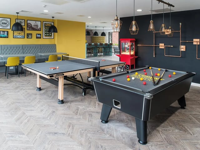 Pool and ping pong tables with seating playing area at Yugo Bentley House in Birmingham Student Accommodation