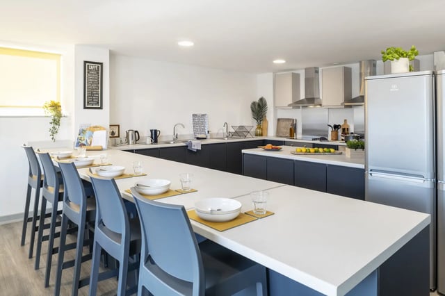 Chairs at breakfast bar with bowls and glasses kitchen at Pine Mill in Lincoln Student Accommodation