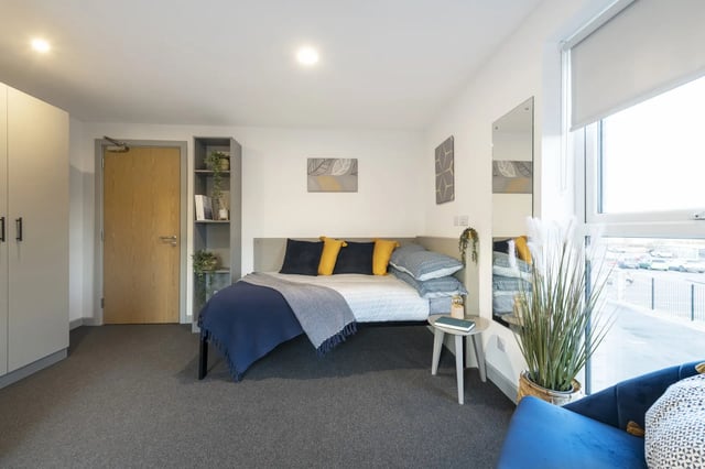 Bed with pillows and blue blanket bedroom at Pine Mill in Lincoln Student Accommodation