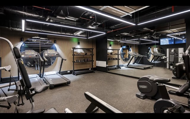 Gym with treadmills weight racks and mirrors gym at Medici in Nottingham Student Accommodation