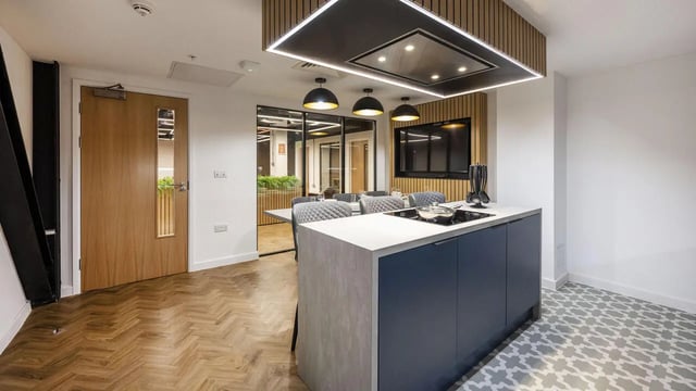 Modern kitchen island with stove dining area kitchen at Medici in Nottingham Student Accommodation