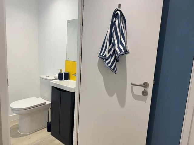 Toilet sink and towel bathroom at Medici in Nottingham Student Accommodation