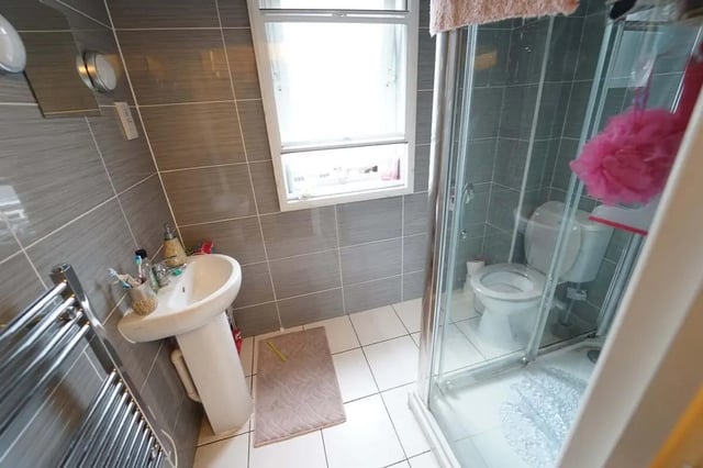 Sink toilet shower and towel rail bathroom at dwell Castle Gate Haus in Nottingham Student Accommodation