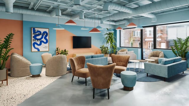 Modern lounge seating with artwork and plants common area at Ladybarn House in Manchester Student Accommodation