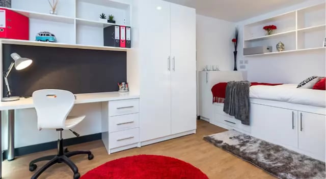 Desk chair bed wardrobe and shelves bedroom at The Court Yard in Southampton Student Accommodation