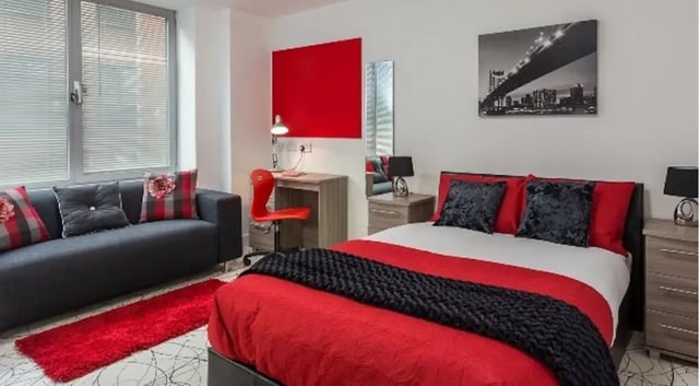 Sofa desk chair bed and rug bedroom at Queens Gate in Southampton Student Accommodation