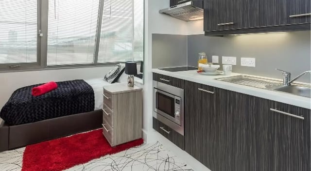 Bed microwave sink and cabinets kitchen at Queens Gate in Southampton Student Accommodation