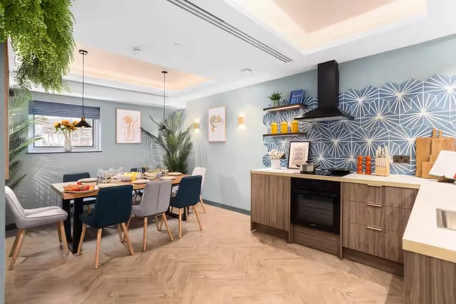 Dining table with chairs and kitchen counter kitchen at London Road Apartments in Southampton Student Accommodation