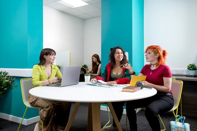 Students collaborating around table study area at Orion Point in Southampton Student Accommodation