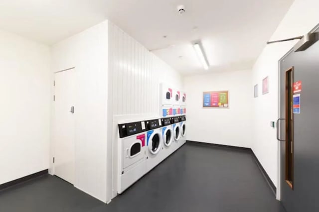 Washing machines and dryers lined up Laundry room at Vincent Place in Southampton Student Accommodation