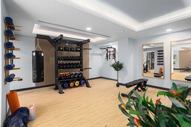 Dumbbells punchbag bench mirrors gym at Brunswick Apartments in Southampton Student Accommodation