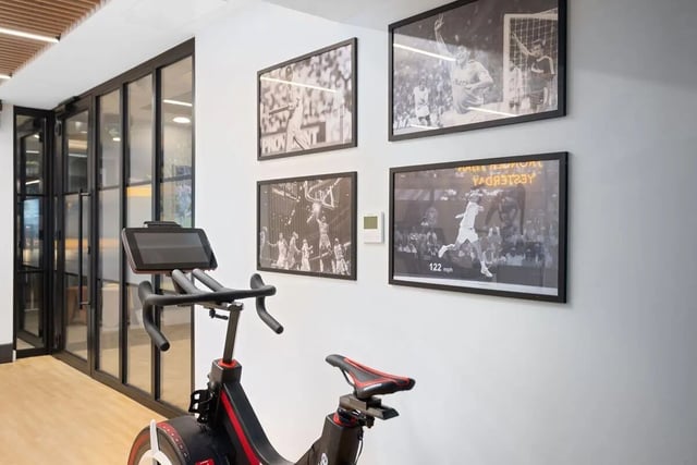 Exercise bike framed sports photos common area at Brunswick Apartments in Southampton Student Accommodation