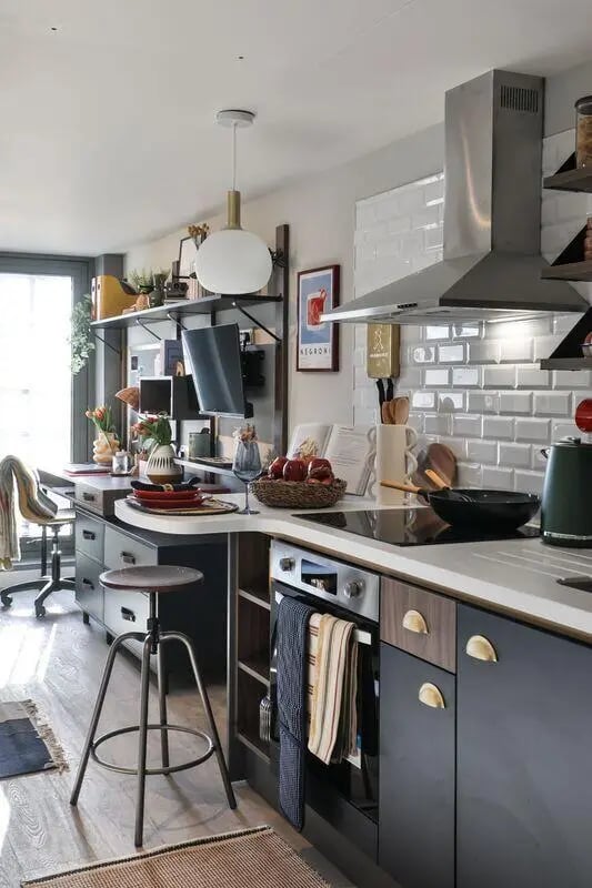 Modern kitchen with counter stools and appliances kitchen at Brunswick Apartments in Southampton Student Accommodation