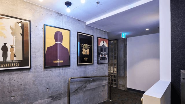 Movie posters on concrete wall corridor at UniLodge Melbourne Flagstaff in Melbourne Student Accommodation
