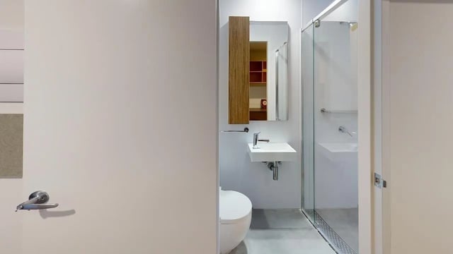 Toilet sink shower with glass door bathroom at Unilodge Melbourne City in Melbourne Student Accommodation