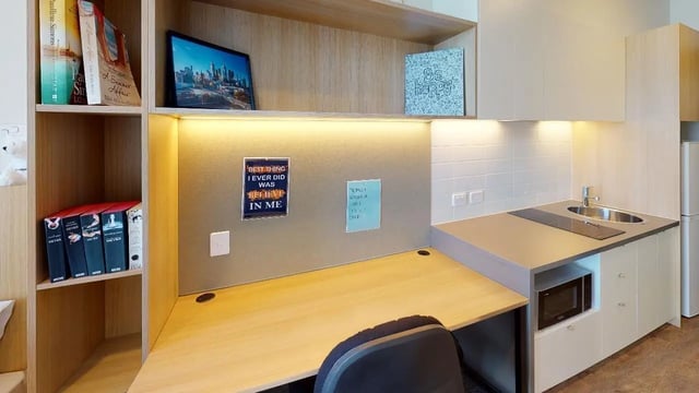 Desk with microwave sink and kitchen studio at Unilodge Melbourne City in Melbourne Student Accommodation