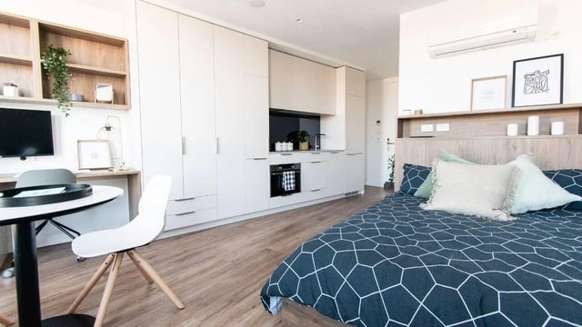 Bed study desk kitchen wardrobes Studio apartment at UniLodge Park Avenue in Melbourne Student Accommodation