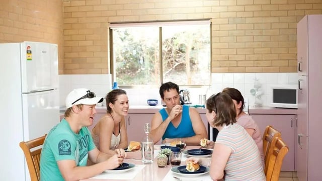 Friends eating lunch at table kitchen area at Unilodge SCU Lismore Orion in Lismore Student Accommodation