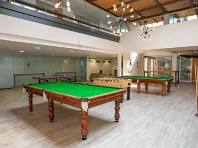 Pool tables foosball table ping pong table game room at @the Lodge UNIVERSITY LIVING in Weatherford Student Accommodation