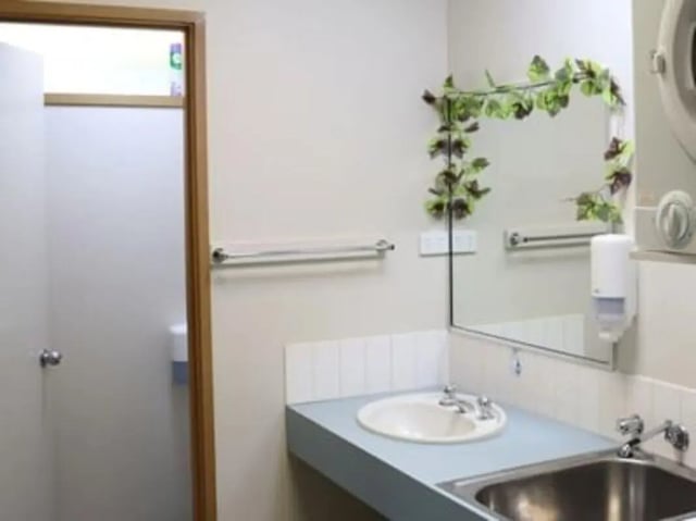 Sink mirror soap dispenser towel rack Bathroom at La Trobe University - Terraces in Melbourne Student Accommodation