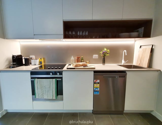 Modern kitchen with appliances, sink, and cookware kitchen at UKO Paddington in Sydney Student Accommodation
