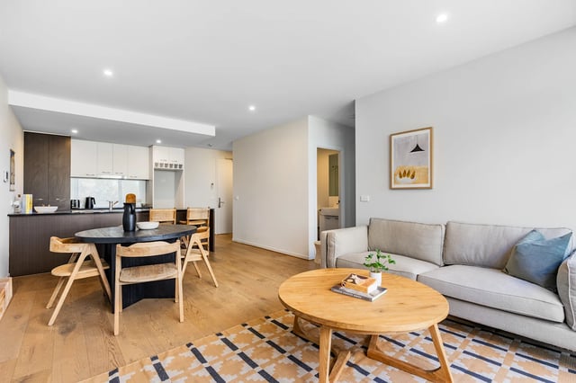 Dining area with kitchen and living room at UKO Royal Park in Melbourne Student Accommodation