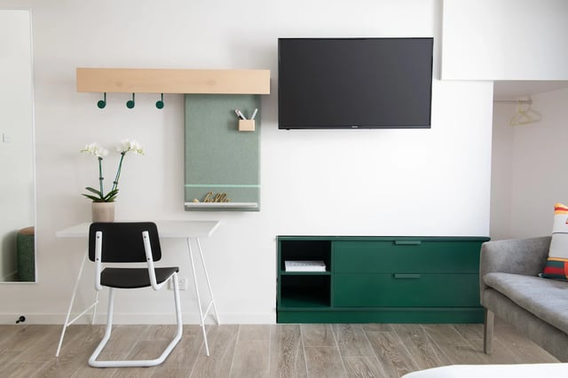 Desk chair orchid plant and TV study area at UKO Stanmore in Sydney Student Accommodation