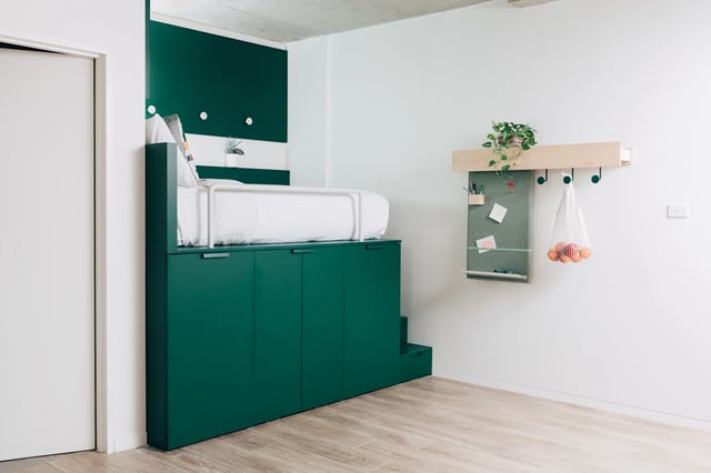 Raised bed over green storage units study area at UKO Stanmore in Sydney Student Accommodation
