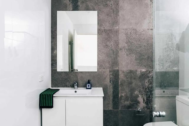 White vanity mirror soap dispenser towel bathroom at UKO Stanmore in Sydney Student Accommodation