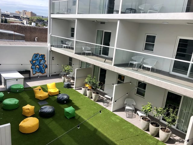 Beanbags and graffiti on lawn area exterior at UKO Stanmore in Sydney Student Accommodation