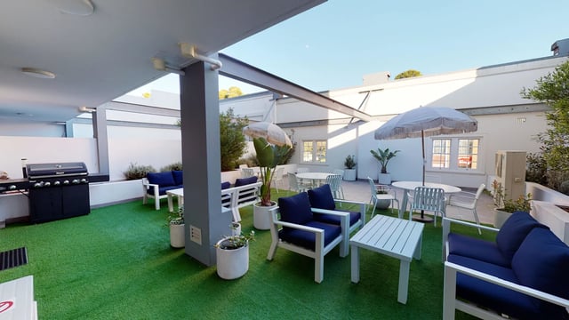 Outdoor seating with grill and tables courtyard at UKO West Ryde in Sydney Student Accommodation