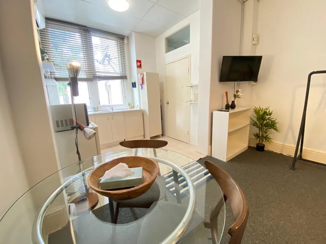 Dining table, kitchen counter, television living area at ume 148 Darlinghurst Village in Sydney Student Accommodation