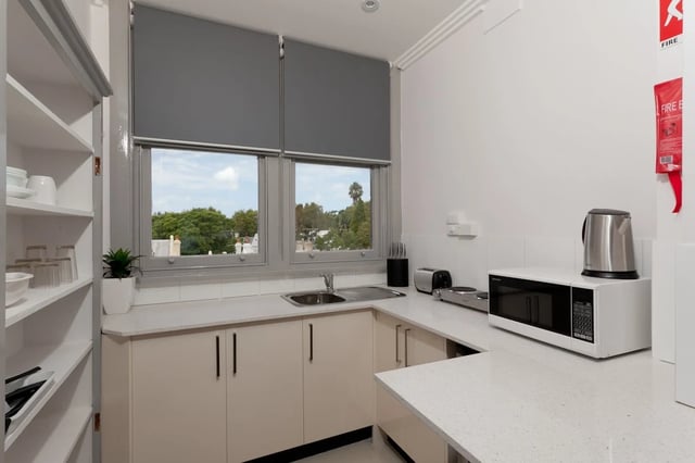 Kitchen counter with microwave kettle toaster kitchen at ume Darlinghurst in Sydney Student Accommodation