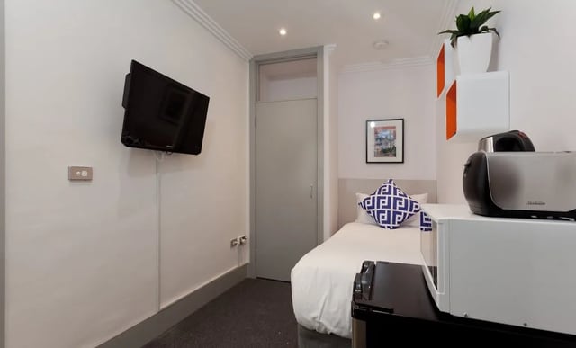 Wall mounted TV microwave toaster bed bedroom at ume Darlinghurst in Sydney Student Accommodation