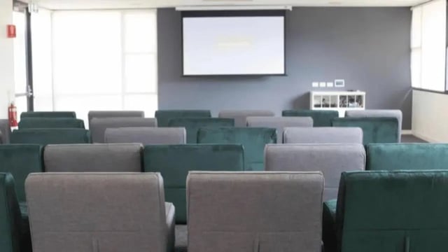 Seating arrangement with projection screen entertainment area at Western Sydney University Campbelltown Village in Sydney Student Accommodation
